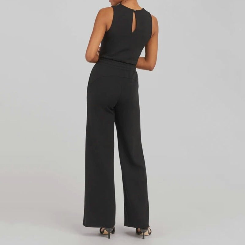 Group of four Rosalie jumpsuits displayed in all available colors: beige, dark green, blue, and black