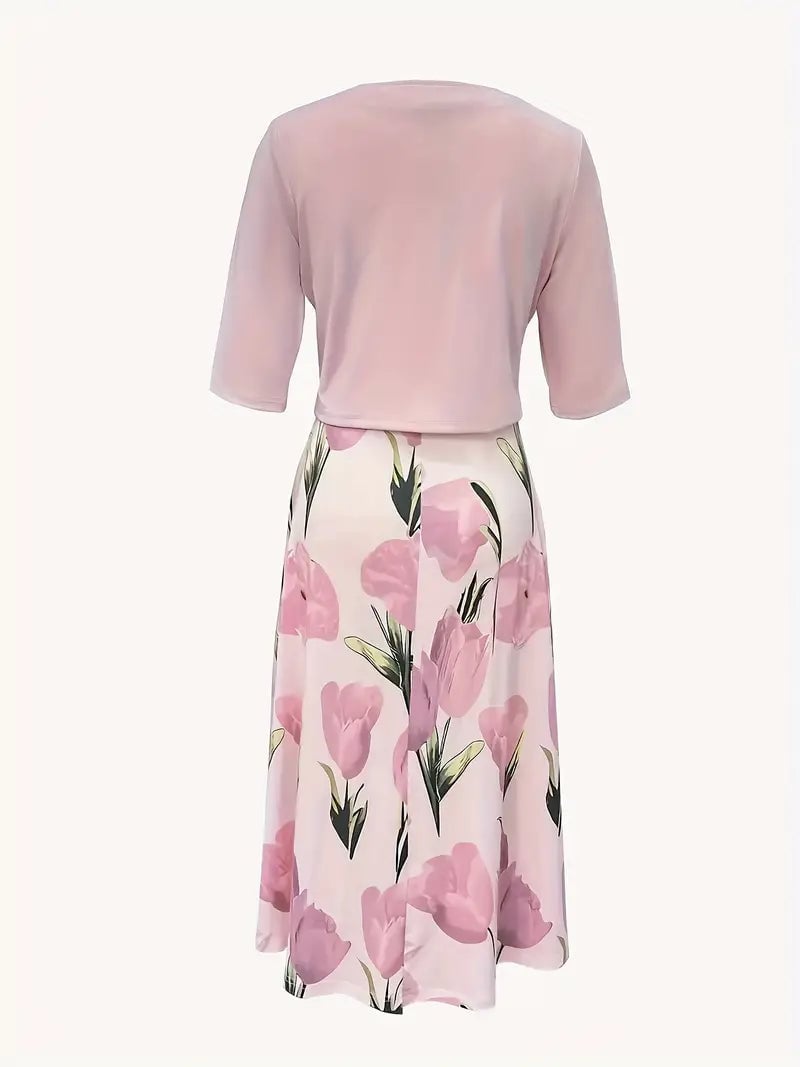 Side view of woman in pink floral maxi dress set with jacket, showing floor-length flowing silhouette