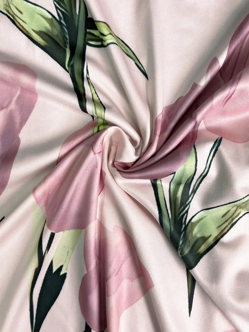 Lifestyle shot of woman in pink floral maxi dress set styled for a spring outdoor occasion