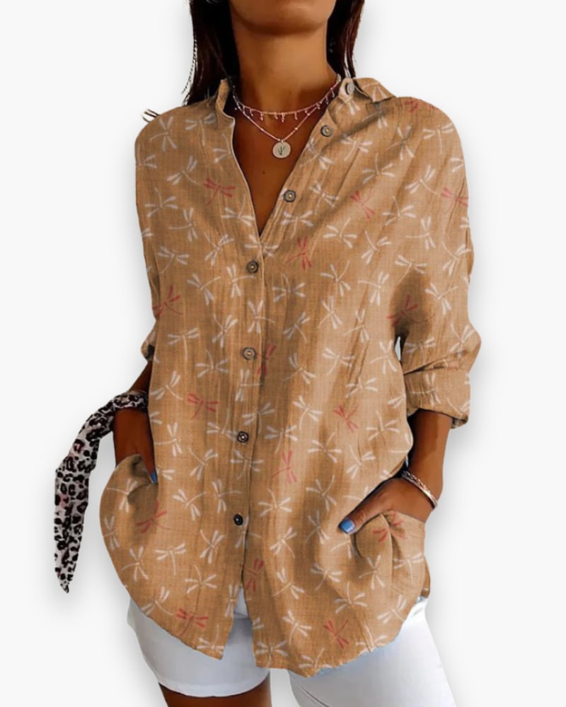 Rosalie floral blouse in brown colorway, styled untucked over jeans