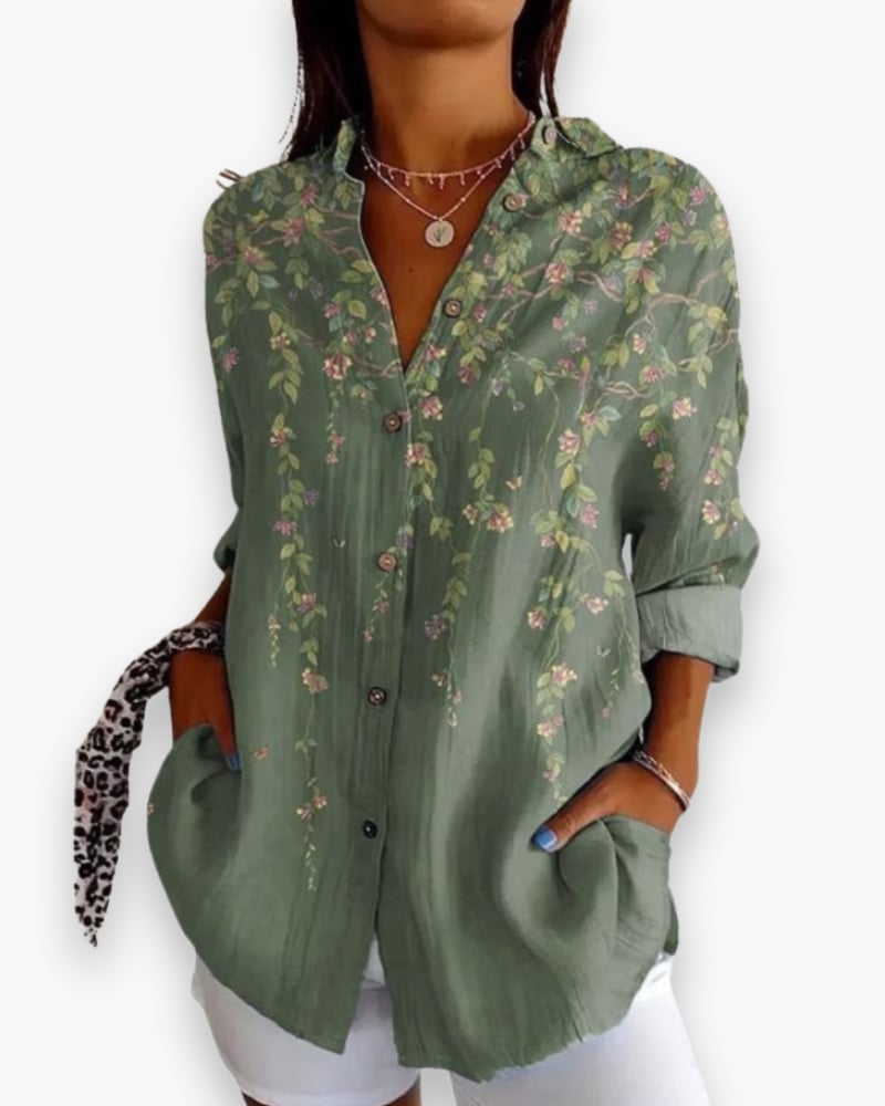 Rosalie floral blouse in olive green, showing hip-length silhouette and painterly floral design