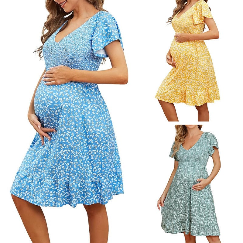Close-up of the soft fabric and draping detail on the Rosalind maternity dress in green