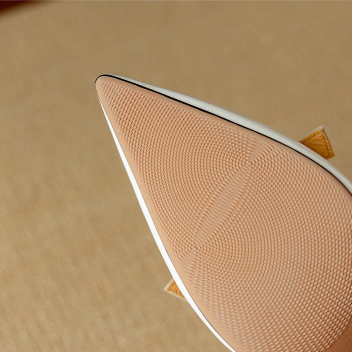 Rosalind white pumps showing flared kitten heel and pointed toe from rear angle