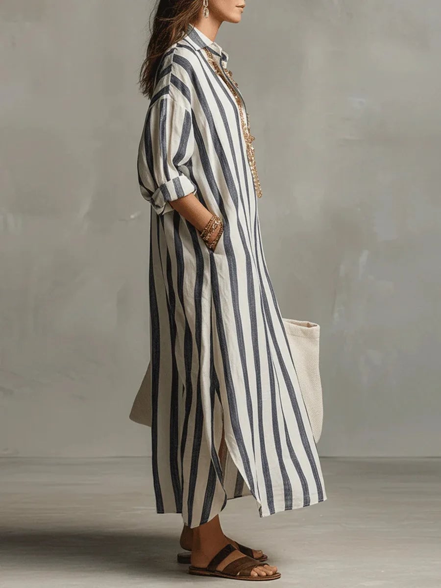 Front view of a striped maxi shirt dress showing the V-neck and rolled-up long sleeves