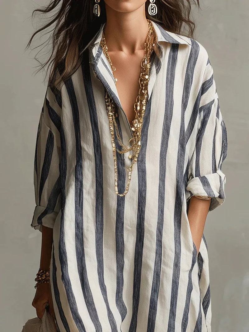 Side view of the Rosalinda striped maxi dress highlighting the flowing ankle-length hem
