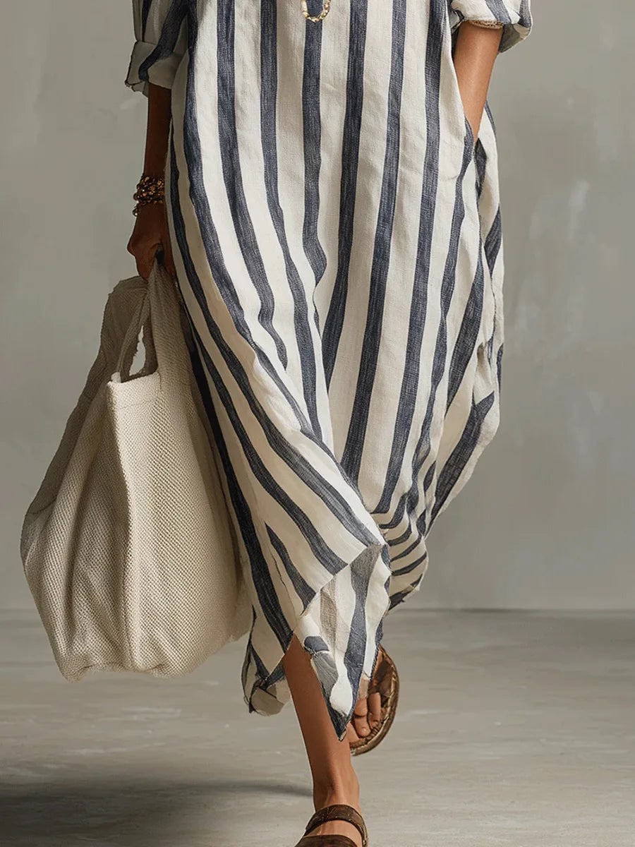 Close-up of the stripe pattern and V-neckline detail on a long sleeve maxi shirt dress