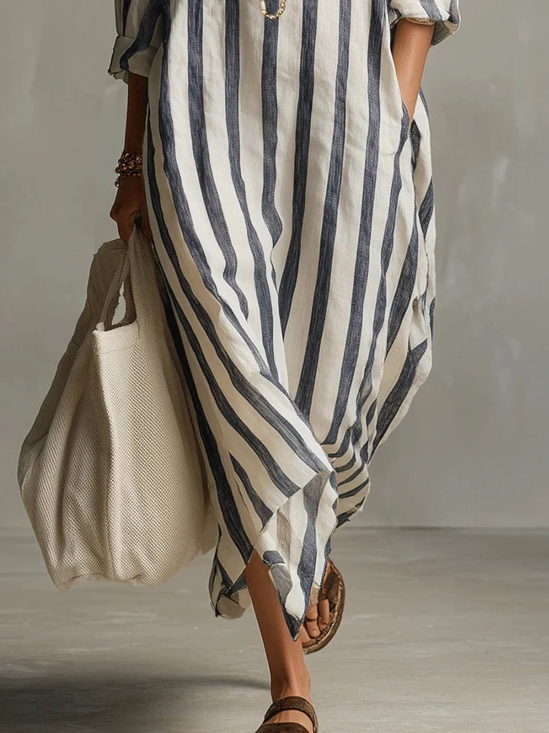 Close-up of the stripe pattern and V-neckline detail on a long sleeve maxi shirt dress