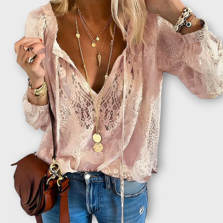 Flat lay of the Rosalynn V-neck lace blouse in black and pink color options