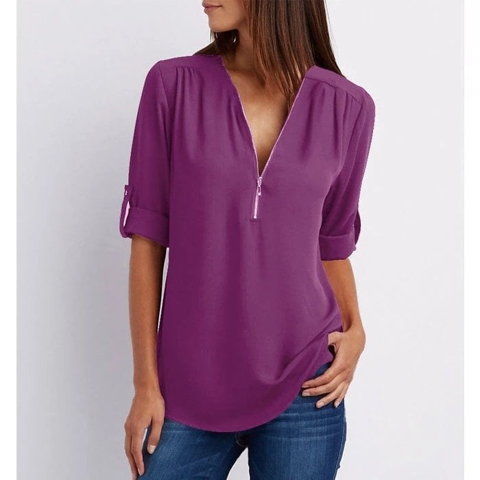 Rosé blouse in brick red showing the relaxed drape and slightly longer curved back hem