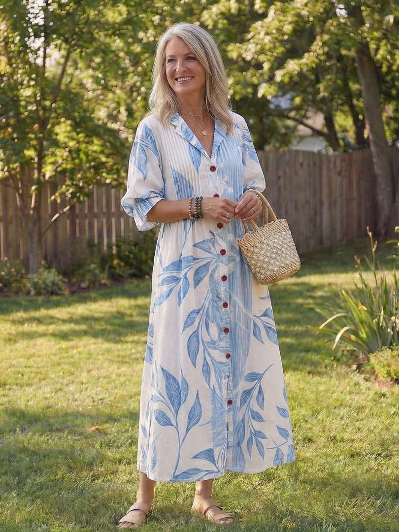 Roselyn maxi dress in floral colorway, side view showing elegant draped hem