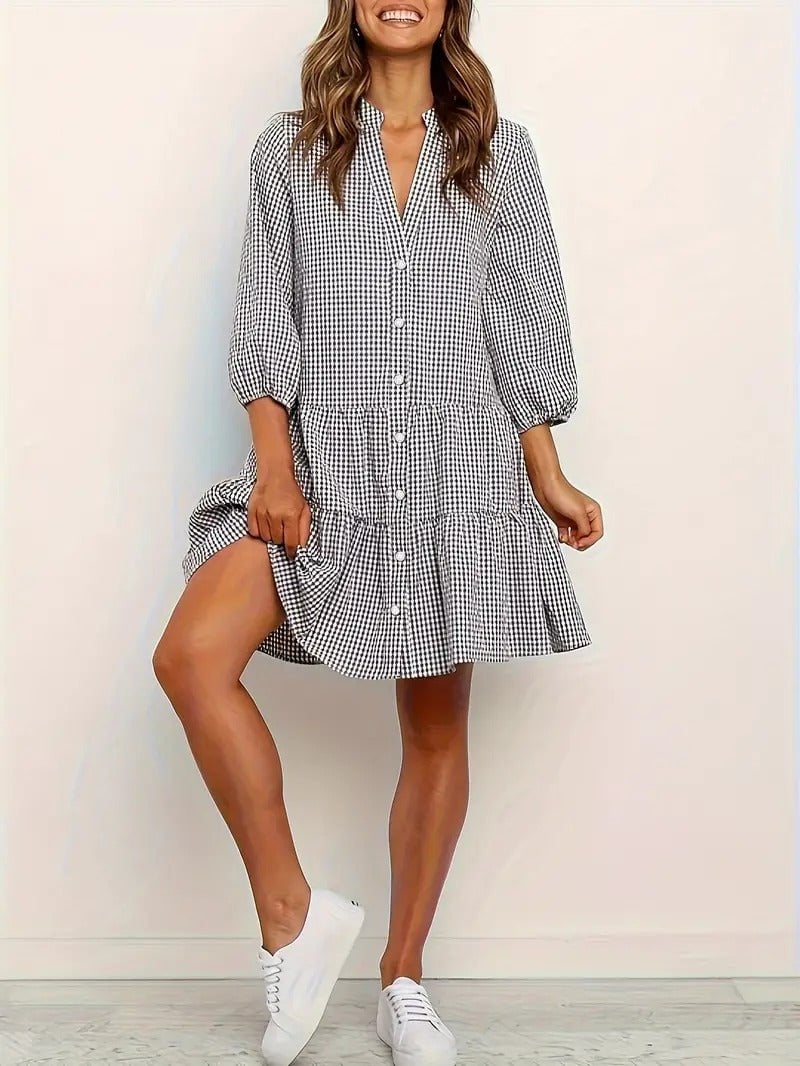 Close-up of the micro-gingham print and V-neckline button detail on the Rosie mini dress in pink