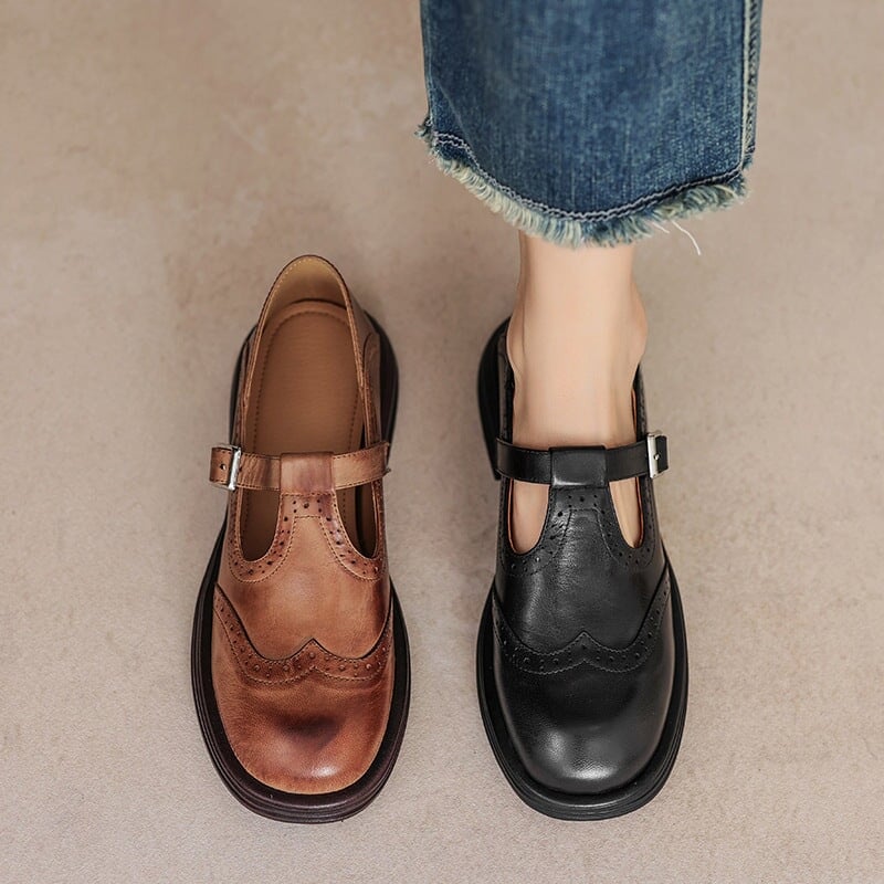 Rosie leather Mary Jane shoes in tan brown on a model, styled with a midi skirt