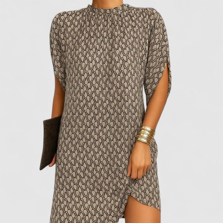 Flat lay of the Rosie midi dress in beige pattern showing the curved hem and sleeve design