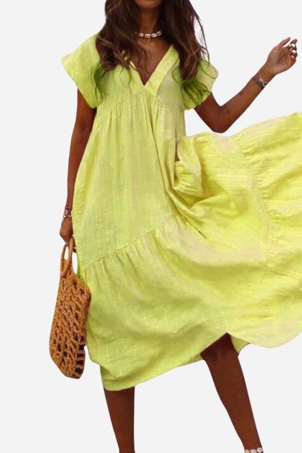 Front view of the Rosie tiered midi dress highlighting the V-neckline and flutter cap sleeves