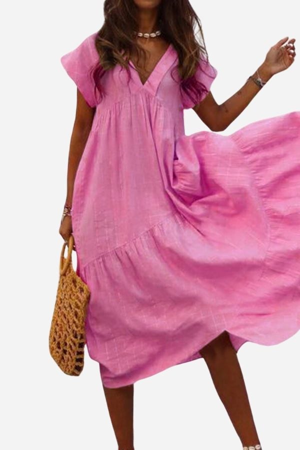 Close-up of the flutter sleeves and V-neckline detail on the Rosie midi dress