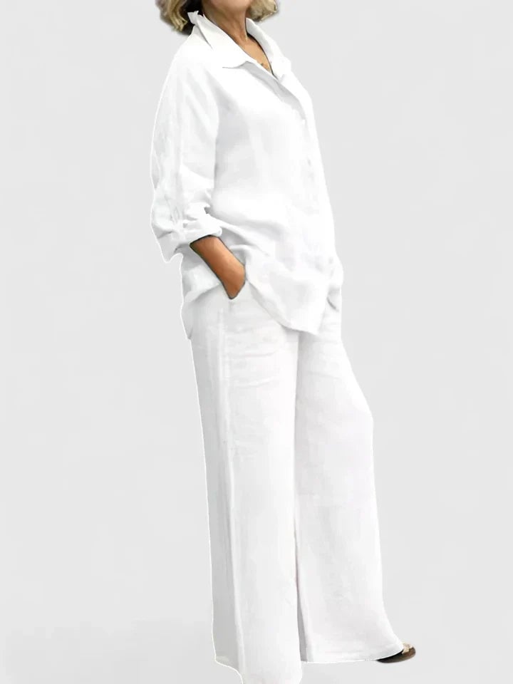 Model wearing Roslyn linen shirt set in orange with sandals