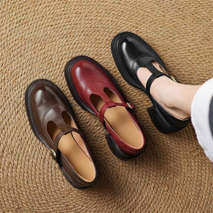 Rowena black Mary Jane pump side view highlighting stable block heel and round toe