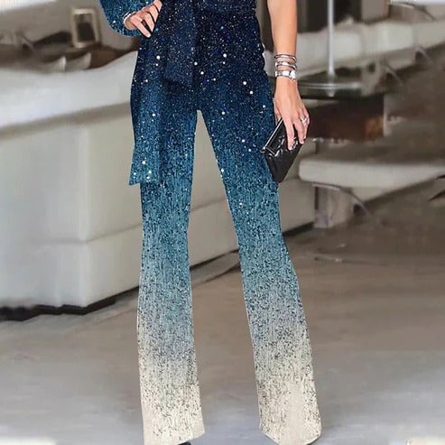 Side view of the Roxanne one-shoulder sequin jumpsuit highlighting the wide flared leg silhouette and belted waist