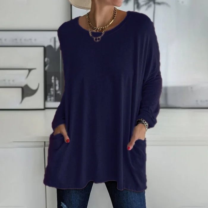 Woman in the Ruby long sleeve tunic top in pink showing the relaxed silhouette