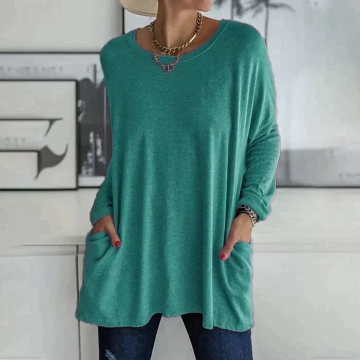 Ruby tunic top in khaki displayed to show the drop-shoulder design and overall length