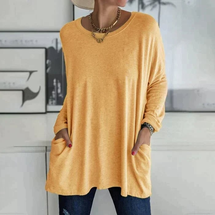 Front view of the Ruby knit tunic top in navy blue showing pocket placement