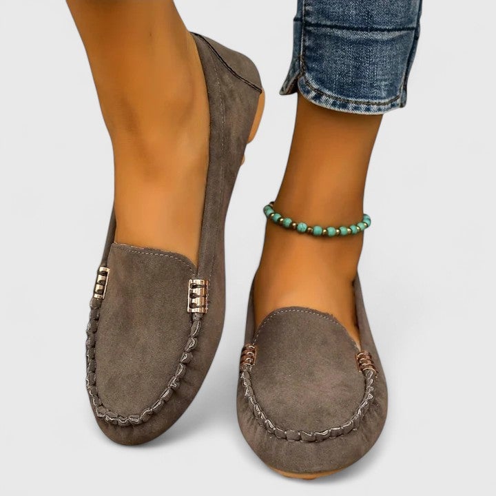 Ruby suede loafers in turquoise with gold bar accent, three-quarter front view