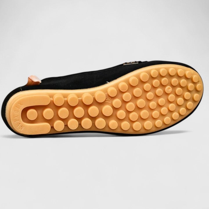 Sole detail of Ruby suede loafers showing flat flexible rubber outsole