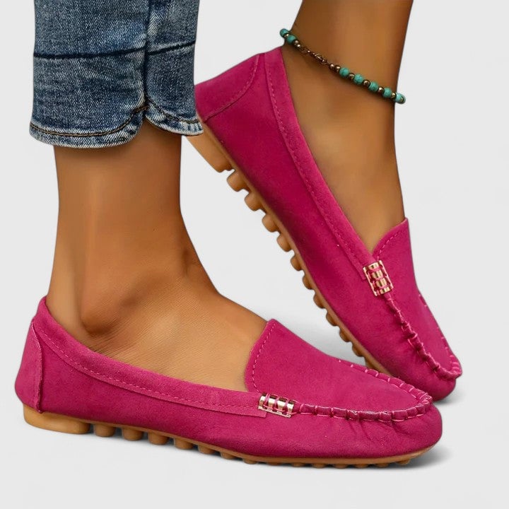 Ruby suede loafers in black styled with neutral trousers for a smart-casual look