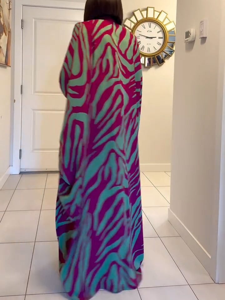 Front view of a purple zebra print batwing maxi dress showing the deep V-neckline and relaxed fit
