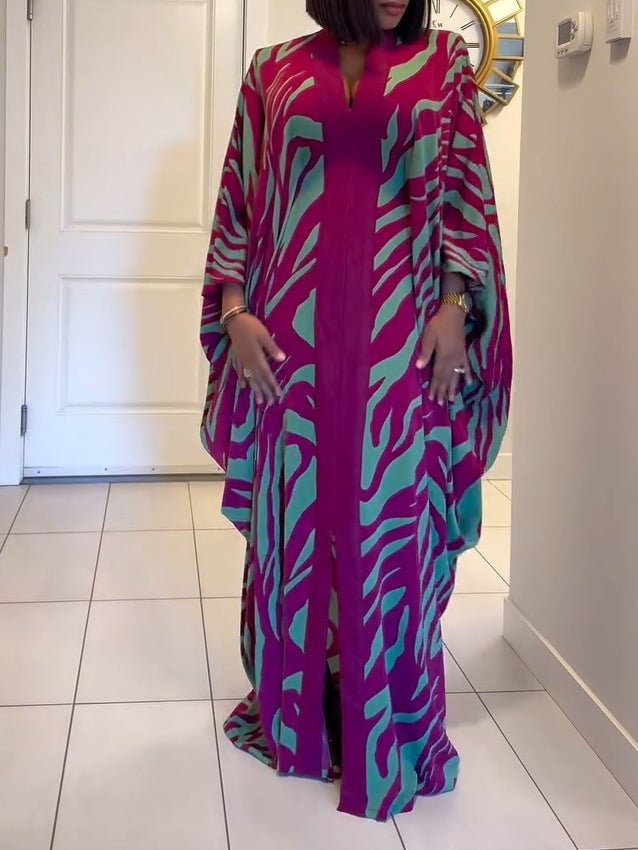 Full-length back view of a purple zebra print robe maxi dress with wide batwing sleeves