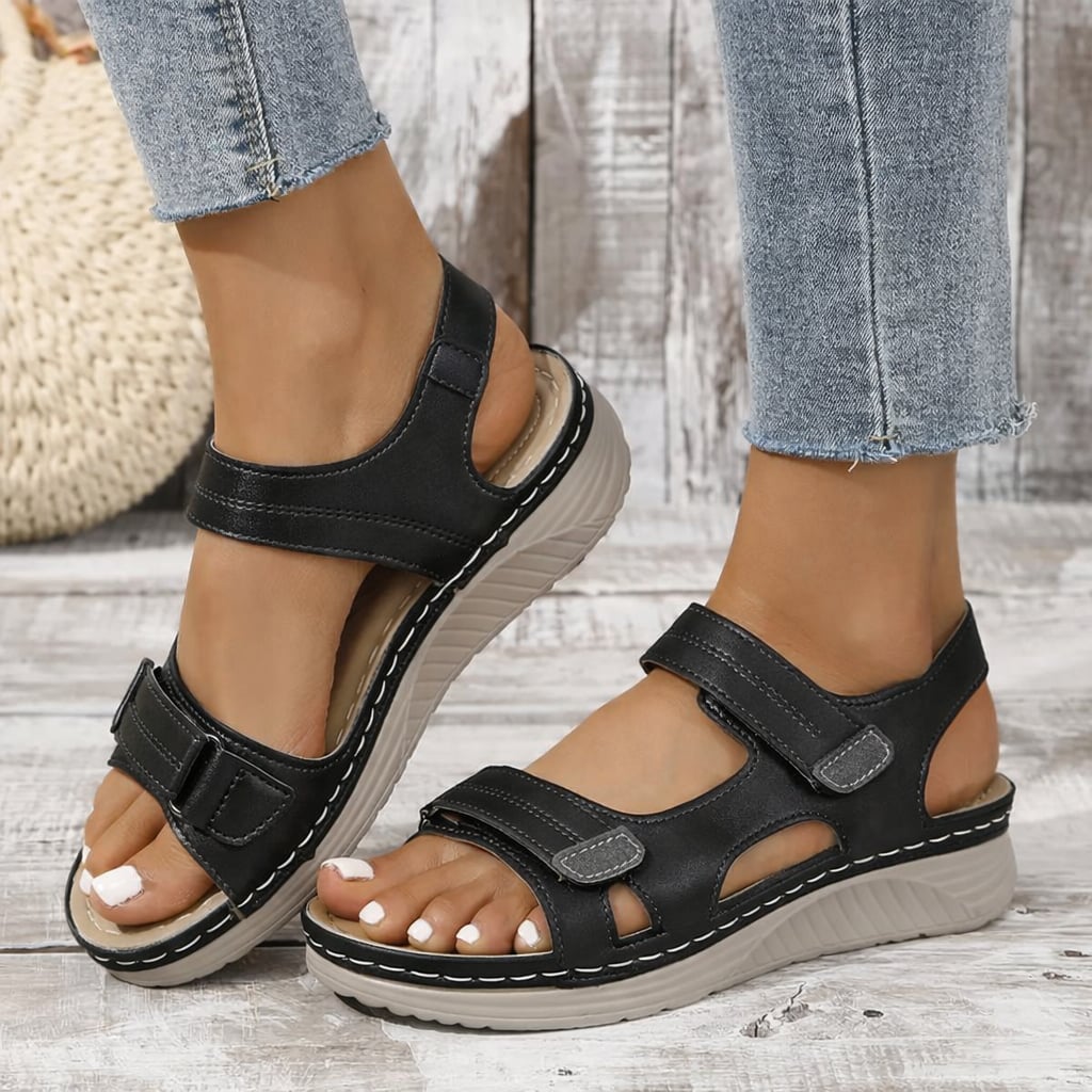 Rue women's orthopedic adjustable sandals in black with cushioned sole and adjustable straps, front view