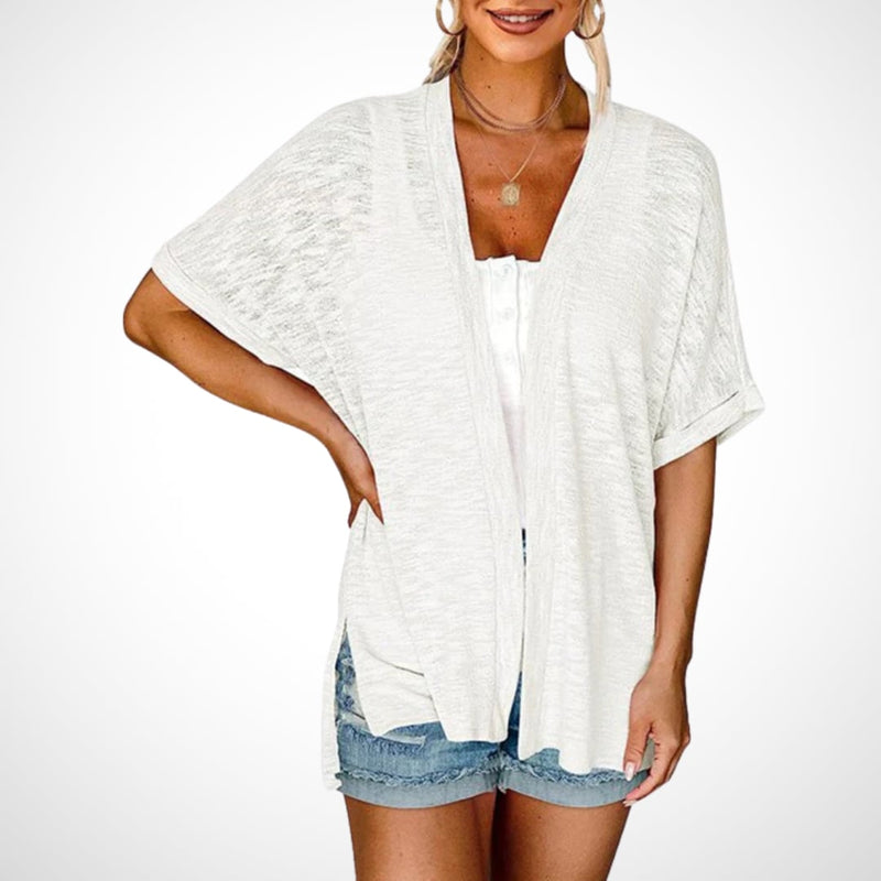 Close-up of flowy short sleeve cardigan fabric showing lightweight drape and soft texture