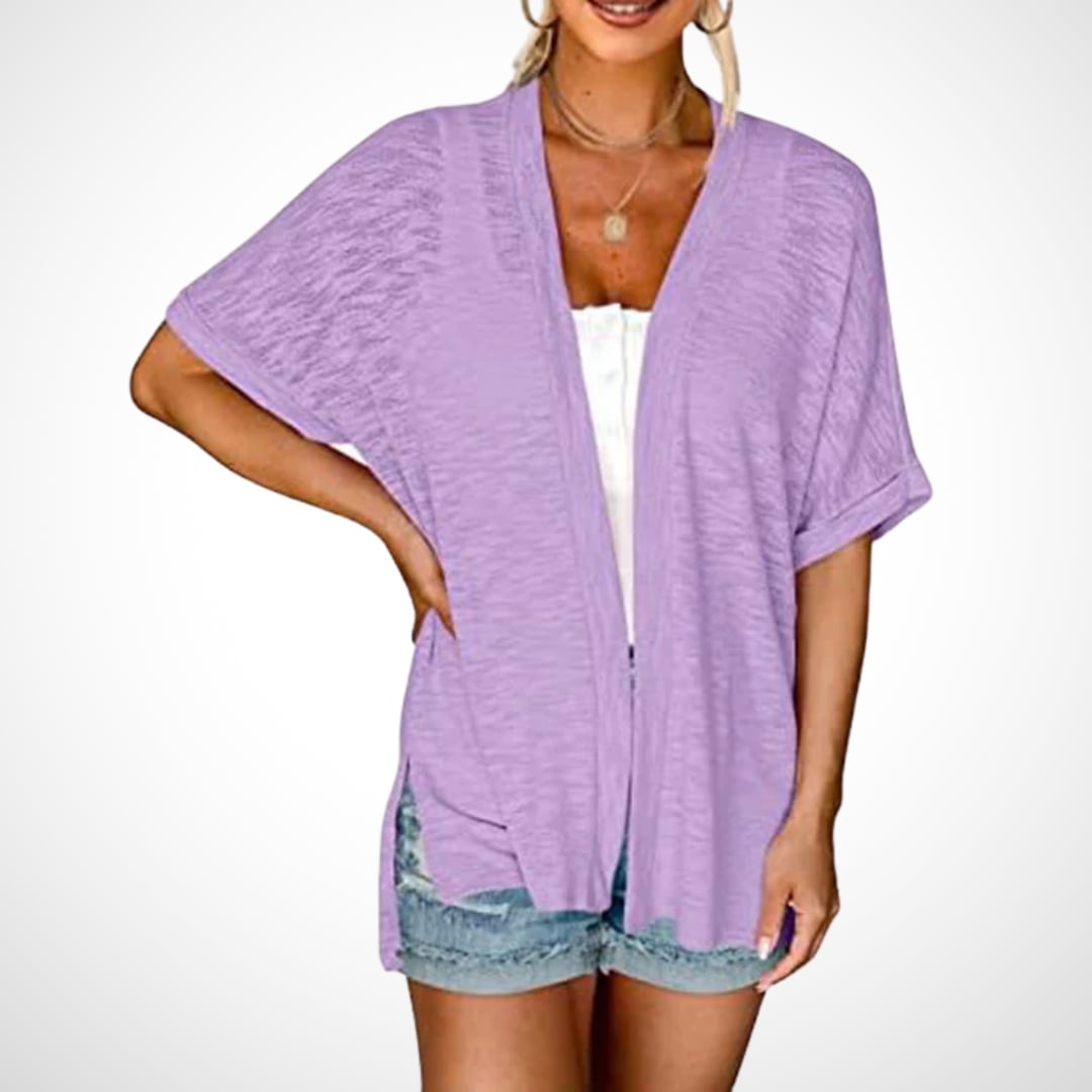 Flat lay of flowy short sleeve cardigan in watermelon red showing full garment shape and length