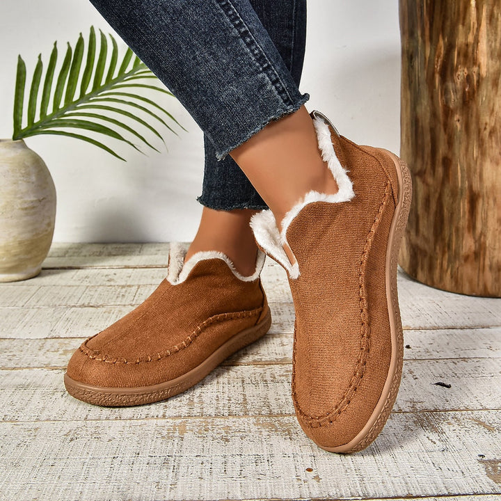 Women's warm fur-lined slip-on ankle boots in brown with thick anti-slip sole, side view
