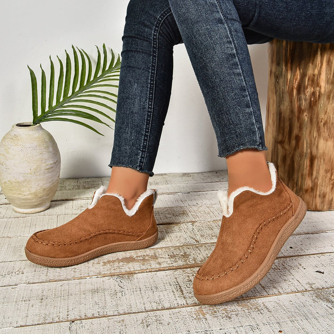 Women's black slip-on ankle boots with anti-slip sole, top-down view
