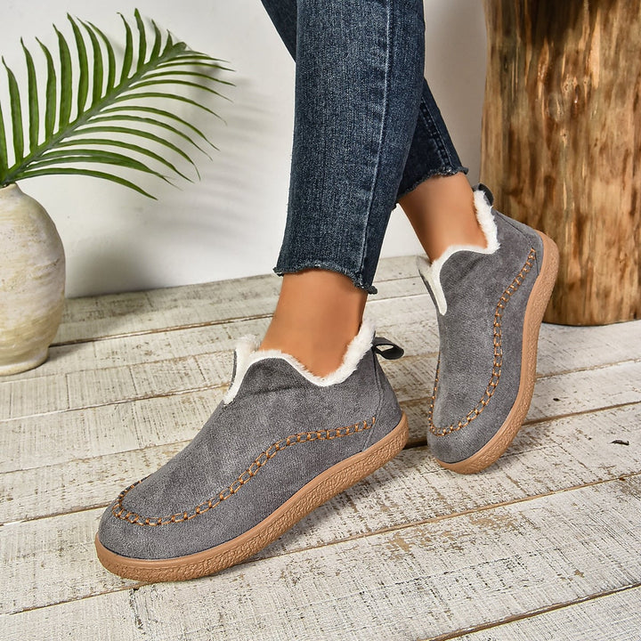 Women's fur-lined ankle boots in all four colors: brown, grey, black, and beige
