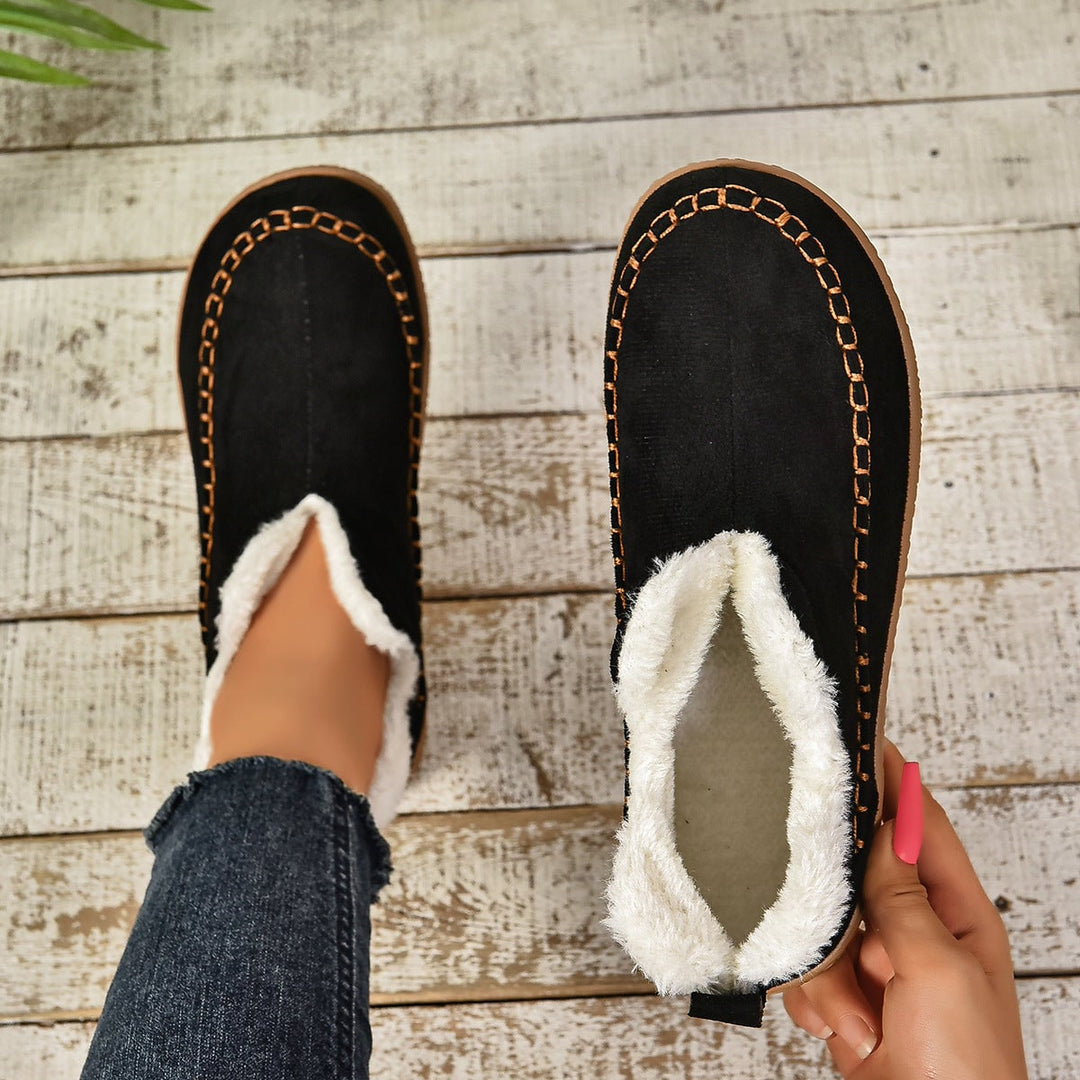 Women's beige fur-lined slip-on ankle boots with anti-slip sole, side view