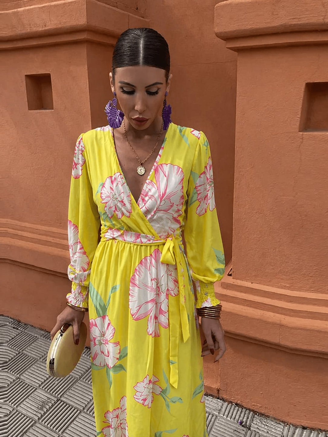 Close-up of the Sabine yellow lace floral dress showing soft neckline detailing and lightweight fabric drape