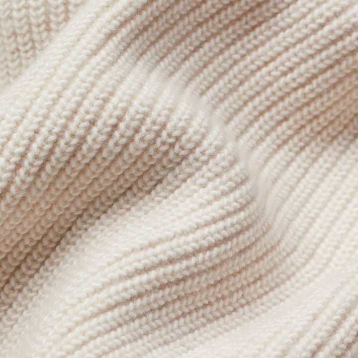 Sadie open cardigan in beige draped over a dress for a polished layered look