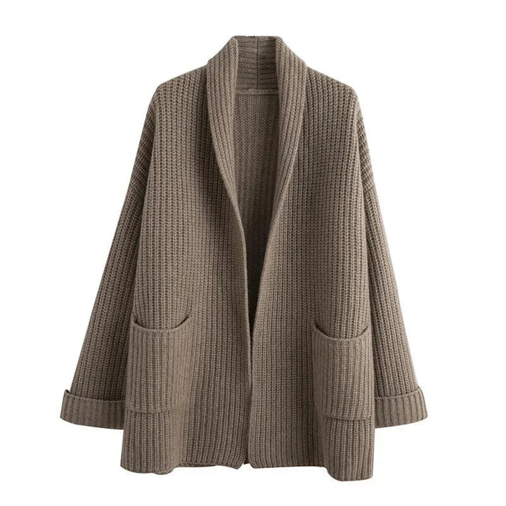 Detail shot of the Sadie cardigan sleeve and open-knit pattern in a neutral beige tone