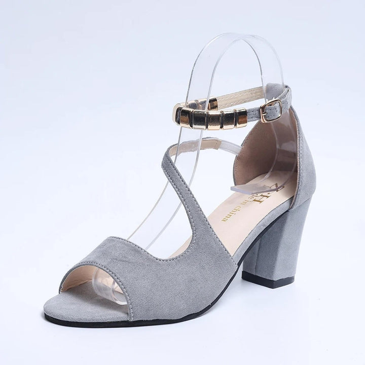 Close-up of Sadie sandal ankle strap gold-tone buckle hardware detail