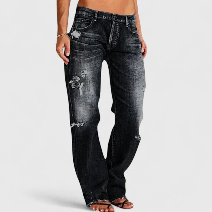 Close-up of distressed knee detailing and whiskering on Sadie straight leg jeans