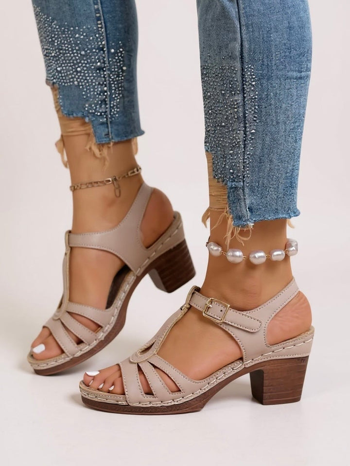 Saffron sandal in Light Gray, angled rear view showing block heel height and sole