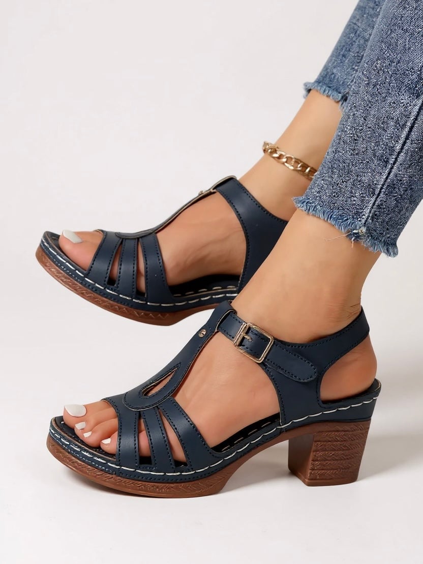 Saffron block heel sandal in Rose Beige worn on foot, styled with a floral midi dress