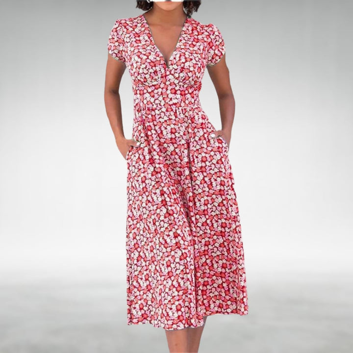 Front view of a floral midi dress featuring a V-neckline and vibrant floral pattern in red colorway
