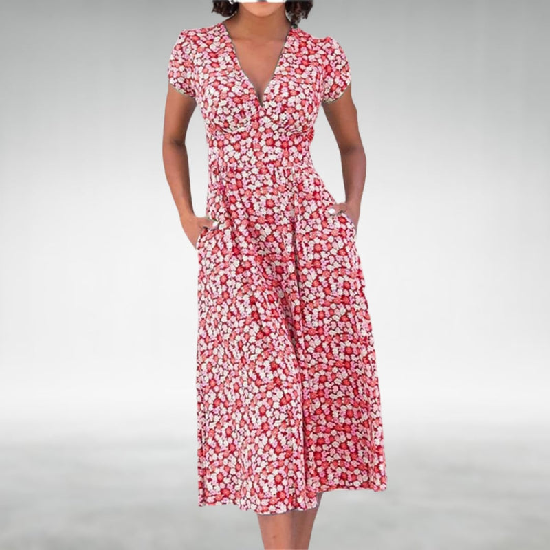 Front view of a floral midi dress featuring a V-neckline and vibrant floral pattern in red colorway