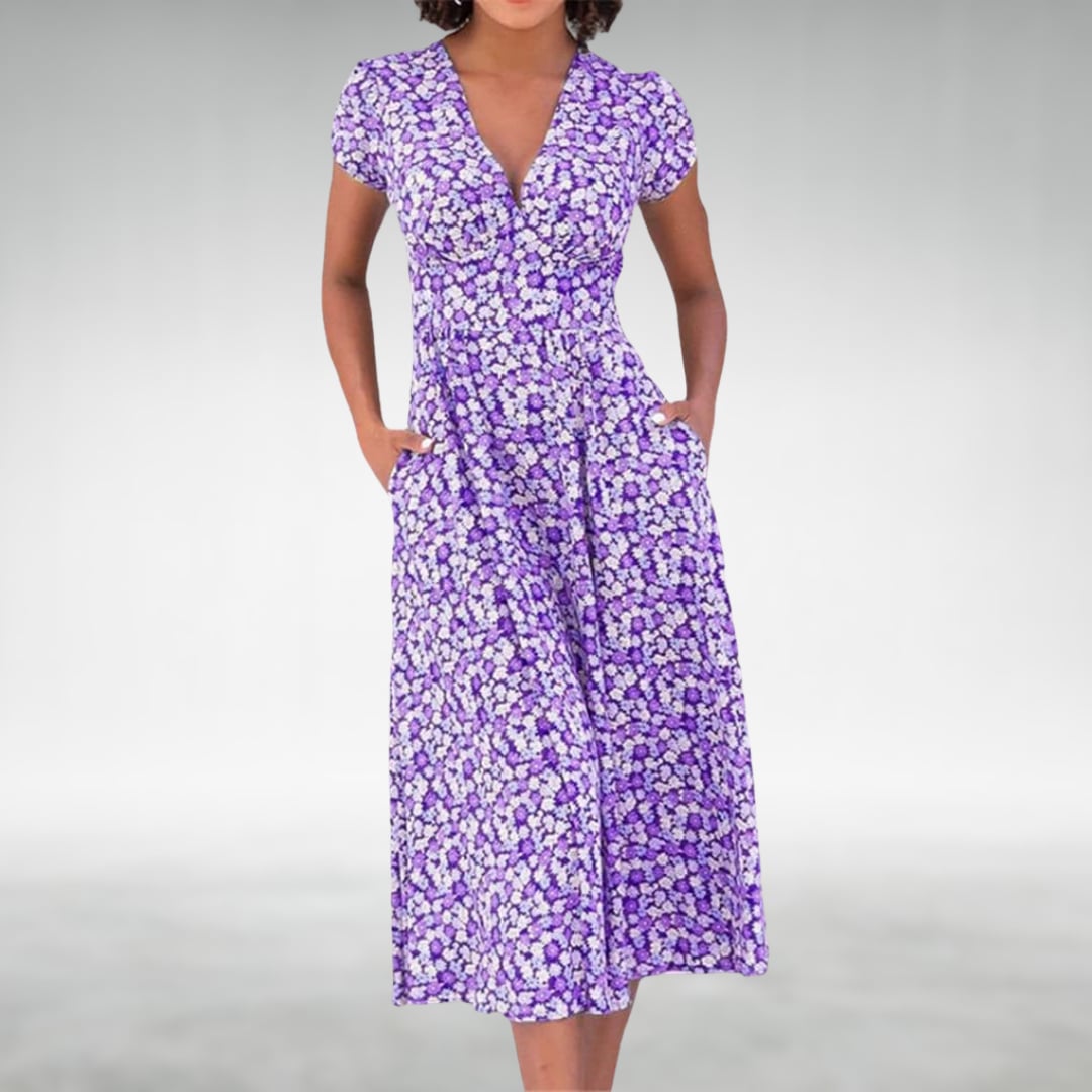 Side view of a lightweight floral midi dress in purple, showing the flowing midi-length silhouette