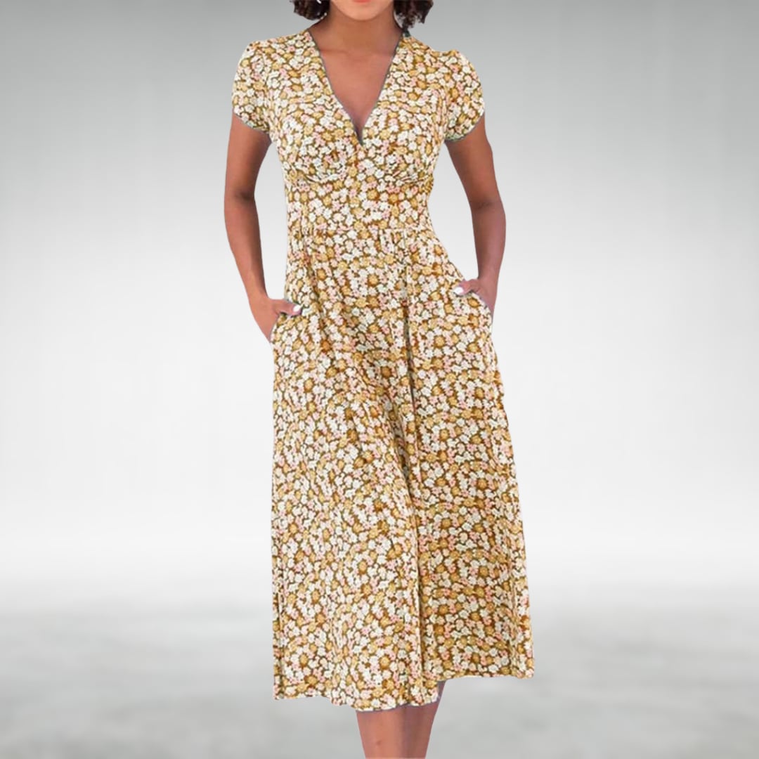 Close-up detail of the floral print and V-neckline on a short-sleeve midi dress in yellow