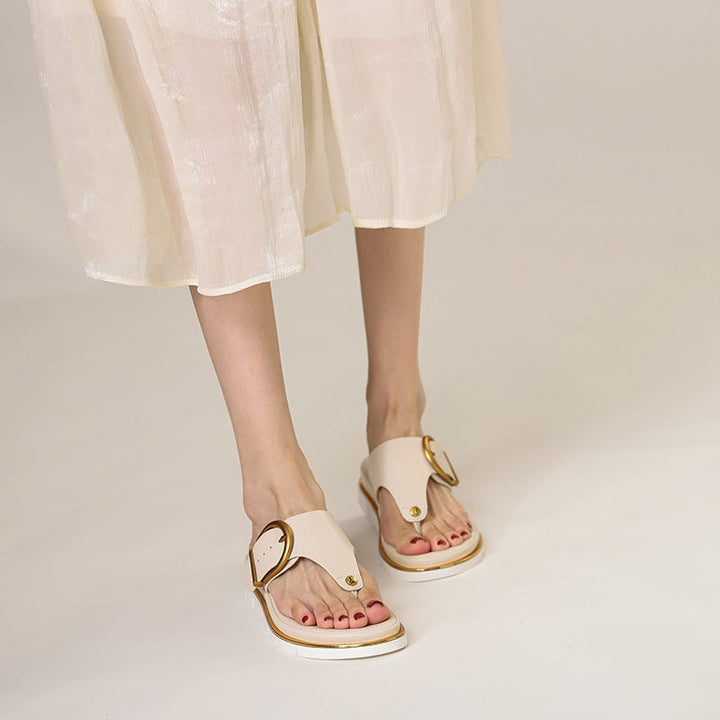 Sage women's sandals styled with a flowy sundress, worn outdoors