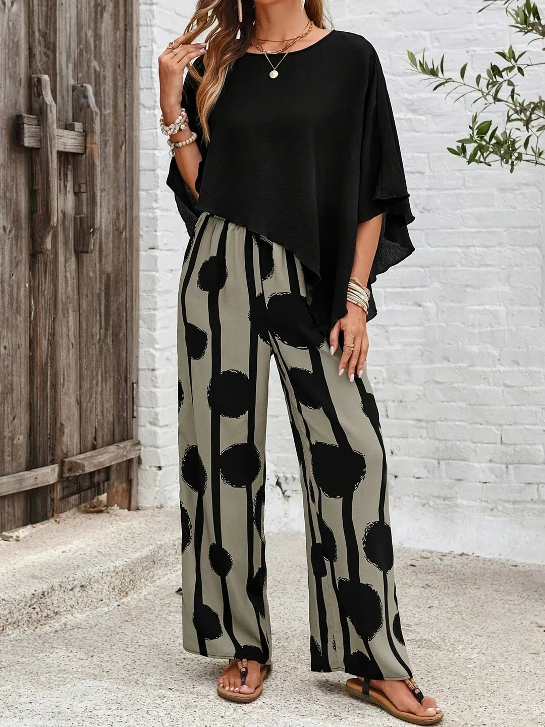 Back view of the Sage 2-piece set highlighting the draped batwing silhouette and flowing wide-leg pants